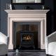 Chesneys’ Clanden fireplace in Portuguese limestone shown with Chesneys’ Beaumont gas stove