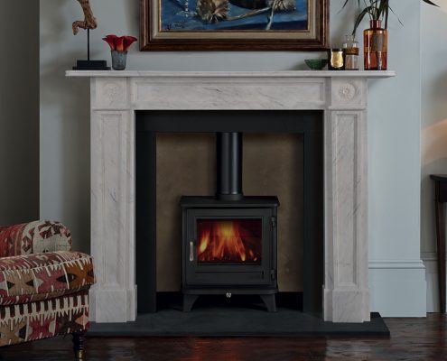 Chesneys’ Langley fireplace in finest statuary marble statuary shown with Chesneys’ Salisbury 5 Series wood burning stove