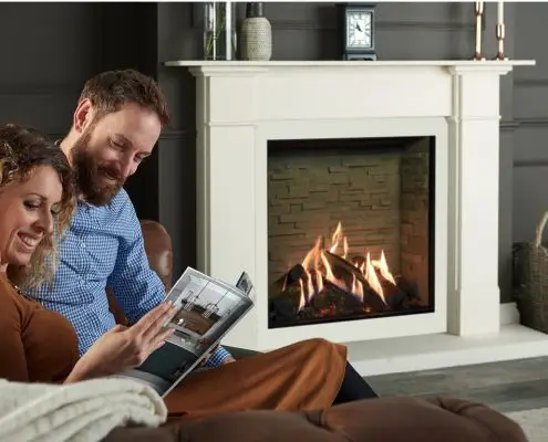 Gazco’s Reflex 75T Edge with Ledgestone effect lining, Claremont Limestone Mantel and matching slip set with large limestone hearth