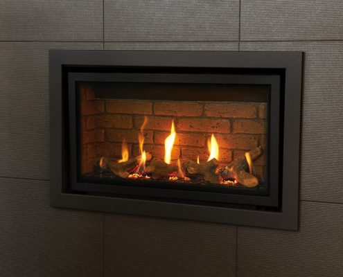 Gazco Studio Slimline Profil gas fire in Anthracite shown with Log-effect fuel bed and Brick-effect lining